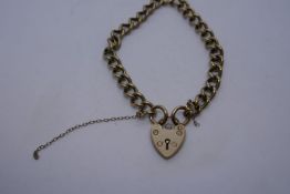 9ct yellow gold curb link bracelet with heart shaped clasp, safety chain AF, marked 375, 22.1g appro