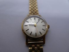 Vintage 9ct yellow gold ladies 'Omega' wristwatch on 9ct yellow gold strap, marked 375, watch ticks,