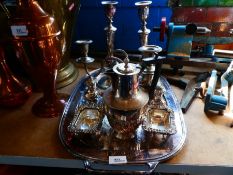 A small quantity of silver plate consisting of a tray, candle sticks, coffee pot, etc