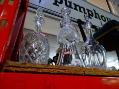 Three lead crystal decanters, one in the form of a Scotch thistle