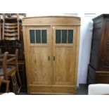 An old stripped pine 2 door wardrobe with green glass panels, 122cm