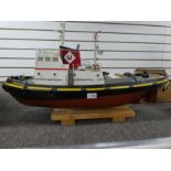 A remote control wooden model tug boat "Minotauros" containing engine and workings, 75cm