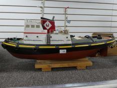 A remote control wooden model tug boat "Minotauros" containing engine and workings, 75cm