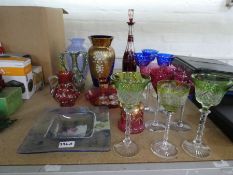 A small quantity of colored glass items including ten flock glasses.