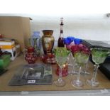 A small quantity of colored glass items including ten flock glasses.