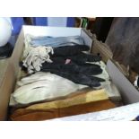 A long women's fur coat and fox stole and a box of vintage gloves