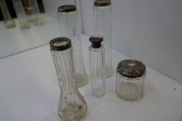 A selection of five silver topped glass jars, nice cut glass decorative examples