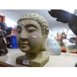 Weathered terracotta Asian buddha bust.