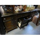 A reproduction twin pedestal desk having nice drawers