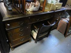 A reproduction twin pedestal desk having nice drawers