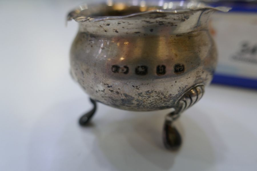 A selection of three silver salts by Asprey and Co Ltd, with lion feet and gadrooned rim. Also with - Image 3 of 4