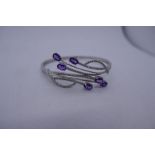 14k White gold contemporary diamond and purple stone, possibly amethyst hinged bangle, marked 14K, 5