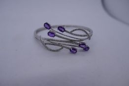 14k White gold contemporary diamond and purple stone, possibly amethyst hinged bangle, marked 14K, 5