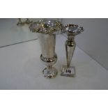 Two silver trumpet shaped vases, one hallmarked London 1914, William Comyns and Sons. The other hall