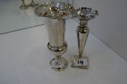 Two silver trumpet shaped vases, one hallmarked London 1914, William Comyns and Sons. The other hall