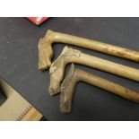 Three continental walking sticks having carved horsehead handles by Kepkvpa