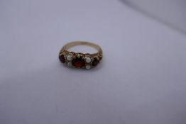 9ct garnet and seed pearl gypsy ring, marked 9ct, 2.6 g approx., size M.