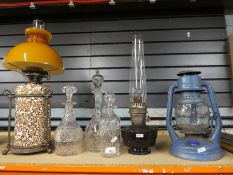 A selection of vintage oil lamps and decanters