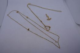 9K yellow gold neckchain hung with 14K yellow gold heart shaped pendant AF, 14K anchor charm togethe