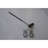 A white metal ladle with a twisted bone handle AF with two 1769 coins on stands