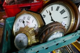Three wall clocks and an aneroid barometer