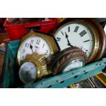 Three wall clocks and an aneroid barometer