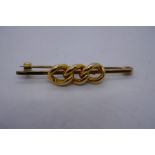 9ct yellow gold bar brooch with 3 x 15ct yellow gold links applied as decoration, 4.5cm, 4.8g approx