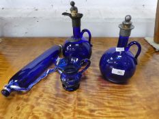 Two similar antique Bristol blue decanters, a glass rolling pin and jug