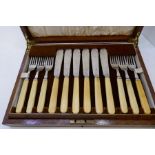 A cased set of 12 silver knives and forks with bone handles AF, in a large wooden box. Hallmarked, S
