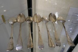 Seven very heavy silver serving spoons, all look identical, four hallmarked London 1911 James Ramsay