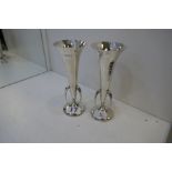 A pair of silver hammered vases in the Arts and Crafts style. Attractive items, with three handles h