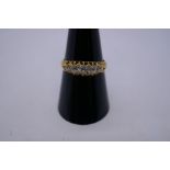 18ct yellow gold gypsy ring set with 5 graduated diamonds, the largest 0.10 pts, set in claw mounts