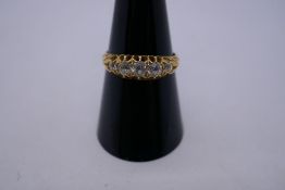 18ct yellow gold gypsy ring set with 5 graduated diamonds, the largest 0.10 pts, set in claw mounts