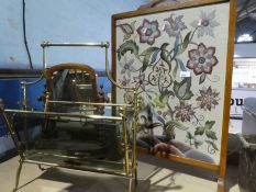 A needlework floral fire screen, a Victorian dressing mirror and a gilt magazine rack