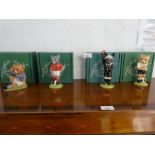 'Footballing Felines', four Beswick figures of cats dressed in football uniforms.