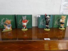 'Footballing Felines', four Beswick figures of cats dressed in football uniforms.