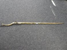 A 19th Century Middle Eastern flintlock musket with brass decoration; length 160cms