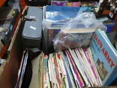 A box of vintage 45s children's books and annuals