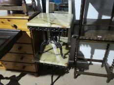 A pair of occasional tables having marble style tops and a paired mirror