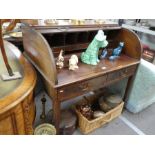 An antique mahogany cylinder Bureau having 2 drawers on square tapered legs, 102cm