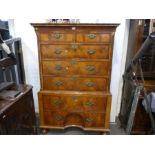 An antique Queen Anne style chest on chest having 2 short and 5 long drawers, the lower drawer havin
