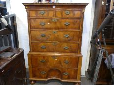 An antique Queen Anne style chest on chest having 2 short and 5 long drawers, the lower drawer havin