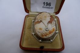 14k yellow gold mounted cameo brooch depicting a lady in evening wear her neck hung with a necklace