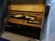 Vintage tool chest containing old tools including saws, levels, chisels, etc
