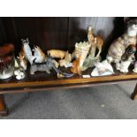 A shelf of animal figures.