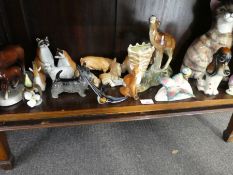 A shelf of animal figures.