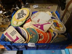 Selection of vintage matchbox corners and beermats.
