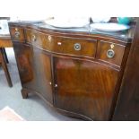 An early 20th century mahogany sideboard having serpentine front with 3 drawers, 107cm