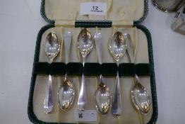 A cased set of six silver teaspoons hallmarked Sheffield 1958, Viners Ltd. Also with two engine turn