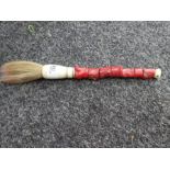 Coral handled brush